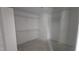 Unfinished walk-in closet with built-in shelving at 121 Tanglewood Dr # 8-J, Louisburg, NC 27549
