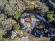 Aerial view of a house and surrounding neighborhood, showcasing the property's location and landscaping at 126 Person St, Louisburg, NC 27549