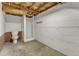 Unfinished basement featuring a toilet and shower, ideal for added bathroom at 126 Person St, Louisburg, NC 27549