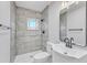 Updated bathroom with tile shower and modern vanity at 126 Person St, Louisburg, NC 27549