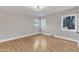 Bright bedroom with hardwood floors and large windows at 126 Person St, Louisburg, NC 27549