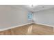 Spacious bedroom with hardwood floors and a window at 126 Person St, Louisburg, NC 27549