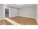 Hardwood floors, barn door and built-in shelving in this bright bedroom at 126 Person St, Louisburg, NC 27549