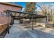 Covered carport with attached garage and brick wall accents at 126 Person St, Louisburg, NC 27549