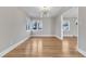 Bright dining room with hardwood floors and stylish light fixture at 126 Person St, Louisburg, NC 27549