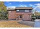 Brick home with a dark trim and a landscaped yard at 126 Person St, Louisburg, NC 27549