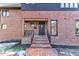 Elegant front entrance with brick steps and a decorative door at 126 Person St, Louisburg, NC 27549