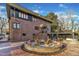 Brick house exterior with a patio and fire pit at 126 Person St, Louisburg, NC 27549