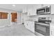 Modern kitchen with granite countertops and stainless steel appliances at 126 Person St, Louisburg, NC 27549