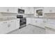Modern kitchen with stainless steel appliances and granite countertops at 126 Person St, Louisburg, NC 27549