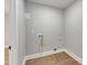 Convenient laundry room with wood flooring at 126 Person St, Louisburg, NC 27549