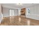 Living room with hardwood floors, fireplace, and barn door at 126 Person St, Louisburg, NC 27549