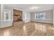 Living room featuring hardwood floors and brick fireplace at 126 Person St, Louisburg, NC 27549