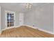 Light-filled office with hardwood floors and neutral walls at 126 Person St, Louisburg, NC 27549