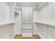 Large walk-in closet with shelves and hanging rods at 126 Person St, Louisburg, NC 27549