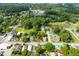 Aerial view showcasing home's neighborhood and pond at 127 E Ridge St, Rocky Mount, NC 27804