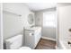 Updated bathroom with granite vanity, a round mirror, and a tub at 127 E Ridge St, Rocky Mount, NC 27804