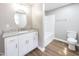 Updated bathroom with granite vanity and tub at 127 E Ridge St, Rocky Mount, NC 27804