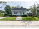 Charming white house with brick steps, a well-maintained lawn, and sidewalk at 127 E Ridge St, Rocky Mount, NC 27804