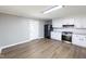 Modern kitchen with white cabinets, stainless steel appliances, and granite countertops at 127 E Ridge St, Rocky Mount, NC 27804