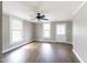 Bright living room with hardwood floors, neutral walls, and large windows at 127 E Ridge St, Rocky Mount, NC 27804