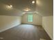 Finished attic with a dormer window allowing natural light to fill the space at 129 Stallion Way, Benson, NC 27504