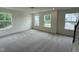 Upstairs bonus room featuring plush carpet, large windows allowing lots of natural light at 129 Stallion Way, Benson, NC 27504