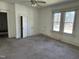 Bedroom with a ceiling fan, carpet floors, and a double window facing the front yard at 1301 Branch St, Rocky Mount, NC 27801