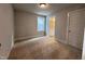 Bedroom with carpet, window, and en-suite bathroom at 144 Weavers Grove Dr # 121, Chapel Hill, NC 27514