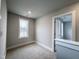Bright bedroom with carpeted floor and large window at 144 Weavers Grove Dr, Chapel Hill, NC 27514