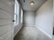 Small bedroom with carpeted floor and two windows at 144 Weavers Grove Dr, Chapel Hill, NC 27514
