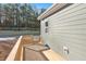 Wooden deck with railing overlooking backyard at 144 Weavers Grove Dr, Chapel Hill, NC 27514