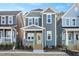 Two-story craftsman style home with light gray siding and a welcoming front porch at 144 Weavers Grove Dr, Chapel Hill, NC 27514