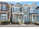 Two-story craftsman style home with light gray siding and a welcoming front porch at 144 Weavers Grove Dr, Chapel Hill, NC 27514