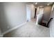 Upstairs hallway with carpeted floors and doors to bedrooms at 144 Weavers Grove Dr, Chapel Hill, NC 27514