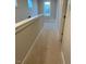 Upstairs hallway with carpeted floor and window at 144 Weavers Grove Dr, Chapel Hill, NC 27514