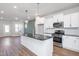 Modern kitchen with white cabinets, granite countertops, and stainless steel appliances at 144 Weavers Grove Dr, Chapel Hill, NC 27514