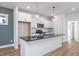 Modern kitchen with white cabinets, granite countertops, and stainless steel appliances at 144 Weavers Grove Dr, Chapel Hill, NC 27514