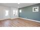 Bright living room with hardwood floors and an accent wall at 144 Weavers Grove Dr, Chapel Hill, NC 27514