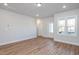 Spacious living room with hardwood floors and neutral walls at 144 Weavers Grove Dr, Chapel Hill, NC 27514