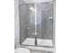 Walk-in shower with gray tiled walls and glass door at 144 Weavers Grove Dr, Chapel Hill, NC 27514