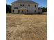 Exterior view of a two-story house in need of landscape and lawn at 145 Surles Landing Way, Benson, NC 27504