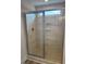 This bathroom features a glass shower with tiled walls, niches, and a window at 145 Surles Landing Way, Benson, NC 27504