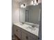Bright bathroom featuring a double sink vanity with modern fixtures and a large mirror at 145 Surles Landing Way, Benson, NC 27504