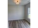 Bedroom with hardwood floors and a window offering natural light at 145 Surles Landing Way, Benson, NC 27504