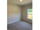 Bedroom with carpet and a window offering natural light at 145 Surles Landing Way, Benson, NC 27504
