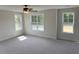 Spacious bedroom with multiple windows and a ceiling fan at 145 Surles Landing Way, Benson, NC 27504