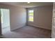 Bedroom with carpet and a window overlooking the outside at 145 Surles Landing Way, Benson, NC 27504