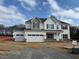 Charming two-story home featuring a two-car garage, stone accents, and a classic design at 145 Surles Landing Way, Benson, NC 27504