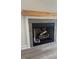 Fireplace with stone surround and a wooden mantel at 145 Surles Landing Way, Benson, NC 27504